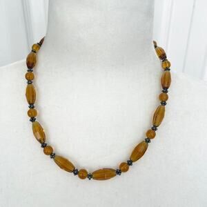 Amber tone beaded hand made station necklace with silver tone S clasp